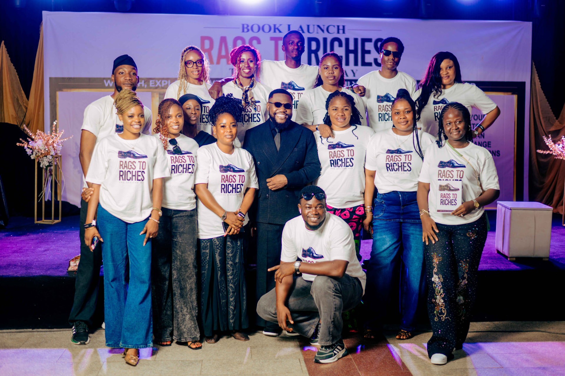 The launch team in Rags to Riches shirts with the author